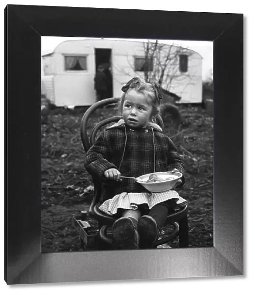 Gipsy girl eating, Lewes, Sussex, 1964