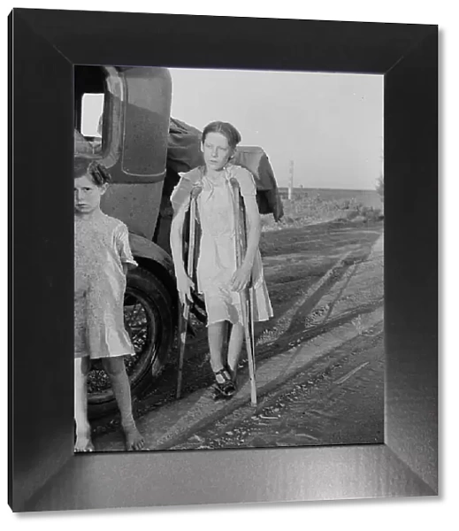 Children of Oklahoma drought refugees on highway near Bakersfield, California, 1935. Creator: Dorothea Lange