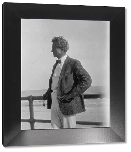 Arnold Genthe at the beach, between 1896 and 1942. Creator: Arnold Genthe