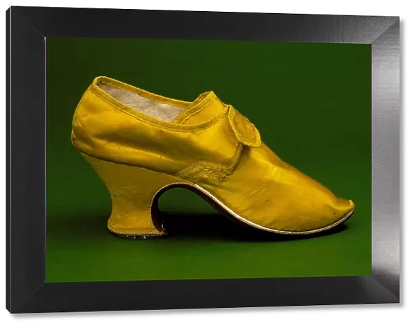 Woman's yellow silk shoe with 'louis heel', England, between c.1760 and c.1765. Creator: Unknown. Woman's yellow silk shoe with 'louis heel', England, between c.1760 and c.1765. Creator: Unknown