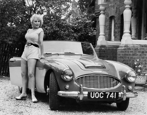 1957 Austin - Healey 100-6 with model. Creator: Unknown