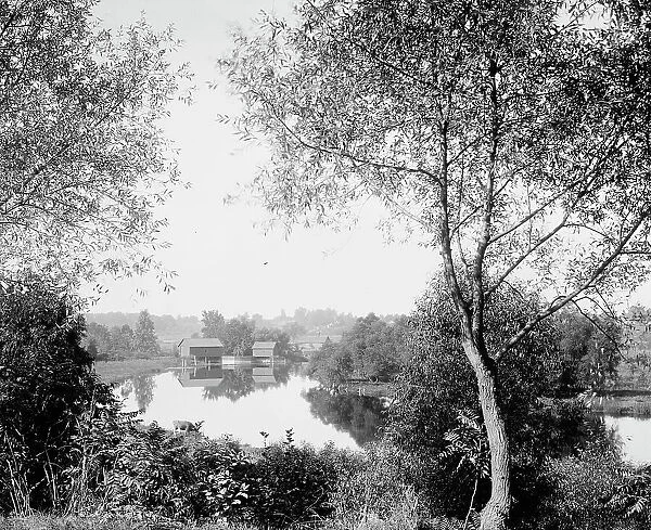 Buildings by river, probably the Huron River, Ypsilanti, Michigan, between 1900 and 1910. Creator: Unknown
