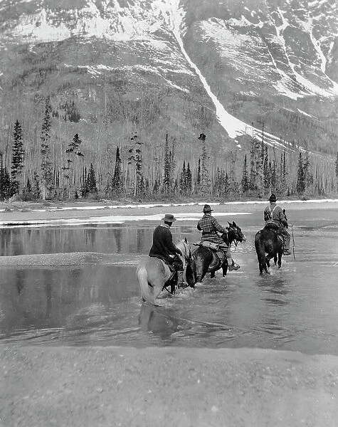 Three campers on horseback cross the Columbia River in Washington, 1903. Creator: Frances Benjamin Johnston