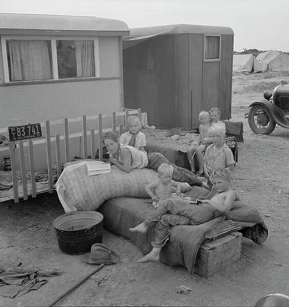 Children from Chickasaw, Oklahoma, in a potato pickers camp near Shafter, California, 1937. Creator: Dorothea Lange