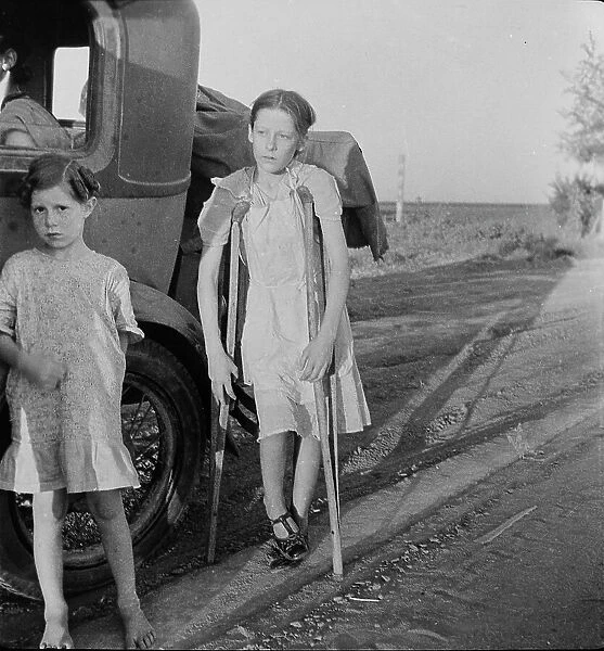 Children of Oklahoma drought refugees on highway near Bakersfield, California, 1935. Creator: Dorothea Lange