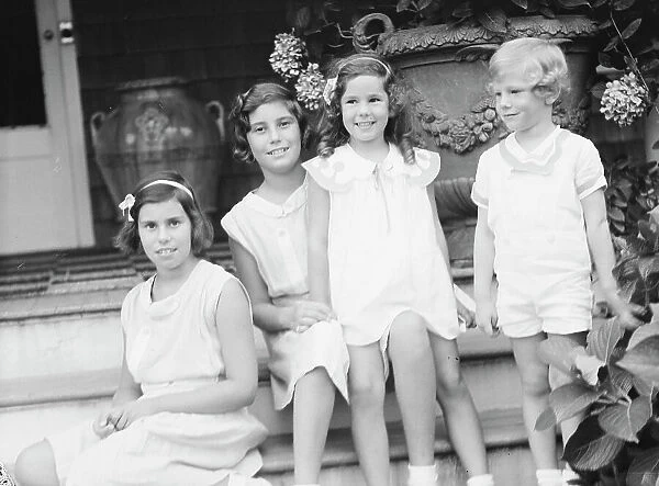 Children of W.G. Kimball, seated on the steps of their house, between 1911 and 1942. Creator: Arnold Genthe