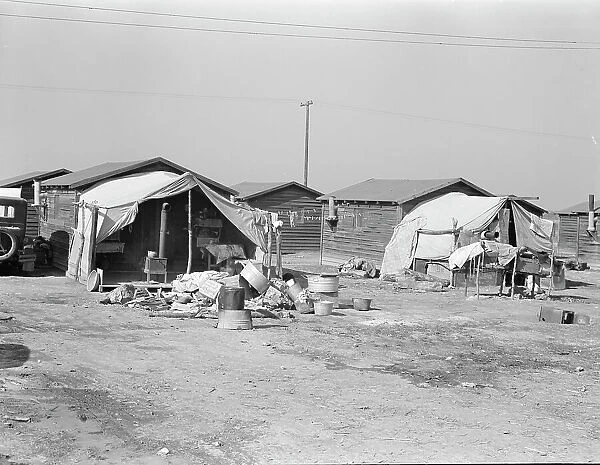 Company housing for cotton workers near Corcoran, California, 1936. Creator: Dorothea Lange