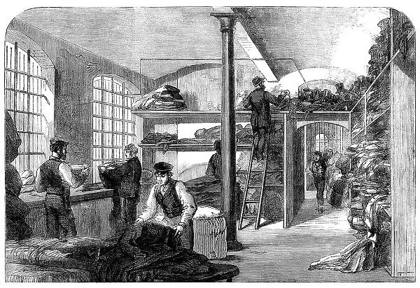 The Cotton Famine: receiving clothes at Bridewell Hospital...for the distressed operatives, 1862. Creator: Unknown