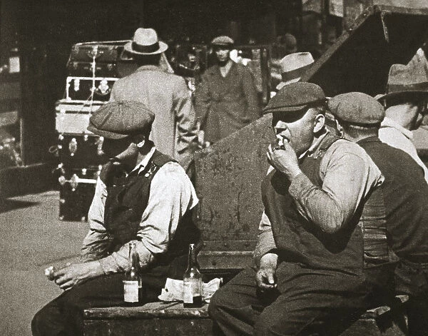 Day labourers having a hot dog and lemonade, Battery Park, New York, USA, early 1930s