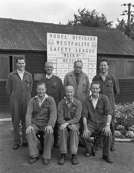 ICI powder works team in front of the Safety League board, Denaby Main, South Yorkshire, 1962