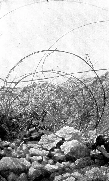 Life in the trenches in Champagne; In the wires of an adjoining trench... 1917. Creator: Unknown
