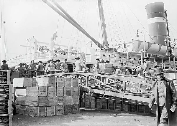 Loading U.S. Army transport ship Meade - League Isl'd. 1913. Creator: Bain News Service