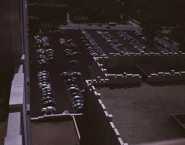 Looking down on a parking lot from the rear of the Fisher Building, Detroit, Mich. 1942. Creator: Arthurs Siegel