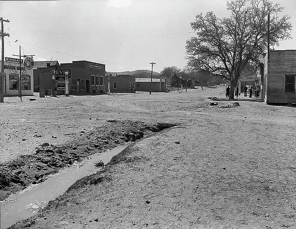 Main street of town showing irrigation ditch, Escalante, Utah, 1936. Creator: Dorothea Lange