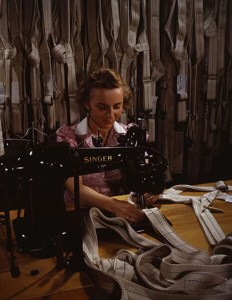 Making harnesses, Mary Saverick stitching, Pioneer Parachute Company Mills, Manchester, Conn. 1942. Creator: William Rittase