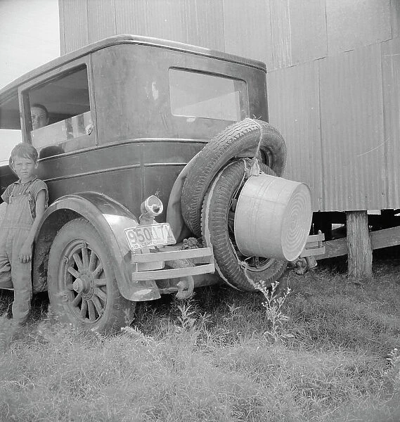 Migrant family's car near Brownsville, Texas, 1936. Creator: Dorothea Lange