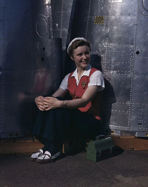 A noontime rest for a full-fledged... Long Beach, Calif. plant of Douglas Aircraft Company, 1942. Creator: Alfred T Palmer