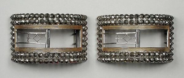 Pair of man's steel and gilt wire shoe buckles, England, c.1777 and c.1785. Creator: Unknown