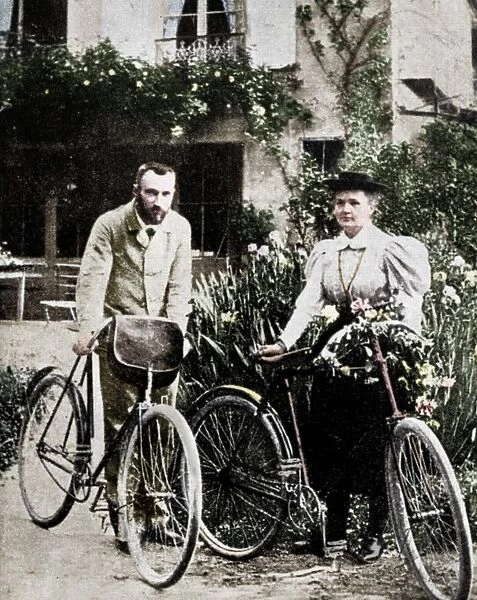 Pierre and Marie Curie, French physicists, preparing to go cycling