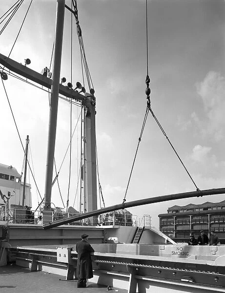 Steel bars being loaded onto the Manchester Renown, Manchester, 1964. Artist