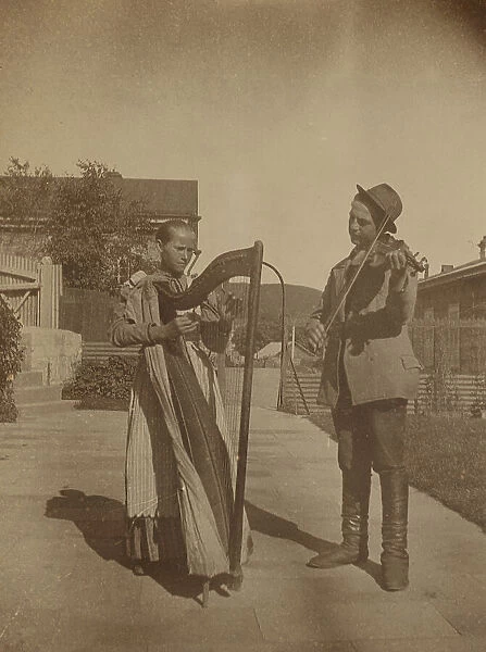 Street musicians with a harp and violin in the upper yard of Dom Smith, Vladivostok, Russia, (1899?) Creator: Eleanor Lord Pray