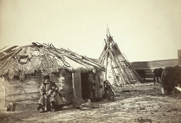 Tatar couple with a small boy in front of their home, between 1885 and 1886. Creator: Unknown