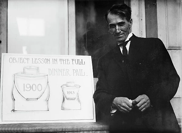 Theron Akin, Rep. from New York; with Full Dinner Pail Placard, 1913. Creator: Harris & Ewing. Theron Akin, Rep. from New York; with Full Dinner Pail Placard, 1913. Creator: Harris & Ewing