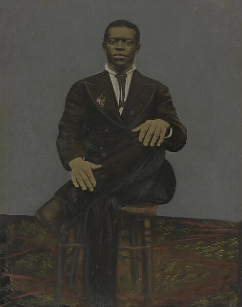 Tintype of a man wearing a suit with a pendant on the lapel, early 20th century