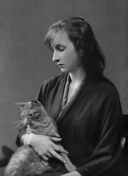 Whittaker, Miss, with Buzzer the cat, portrait photograph, 1916. Creator: Arnold Genthe