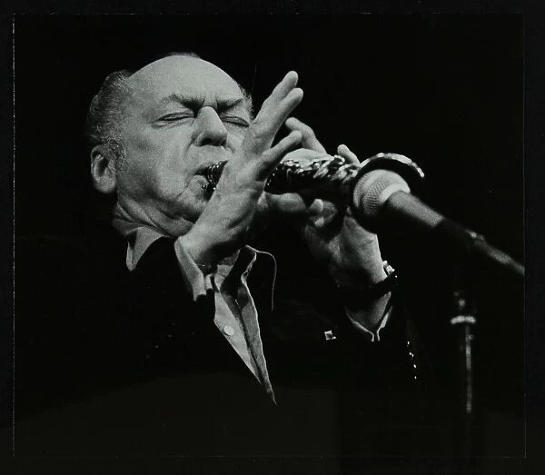 Woody Herman playing his clarinet at the Forum Theatre, Hatfield, Hertfordshire, 24 May 1983