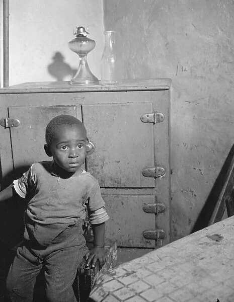 A young boy who lives near the nations capitol, Washington, D. C. 1942. Creator: Gordon Parks