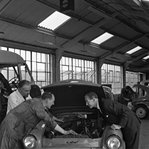 Automotive supplies representative with a 1960 Hillman Husky at a Sheffield Garage, 1963