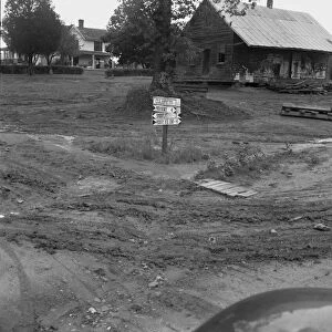 Crossroads hamlet after a rain, Culbreth, Granville County, North Carolina, 1939. Creator: Dorothea Lange