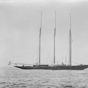 Three masted schooner at anchor. Creator: Kirk & Sons of Cowes