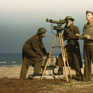 Men of Fort Story operate an azimuth instrument, to measure the angle... Fort Story, Va. 1942. Creator: Alfred T Palmer