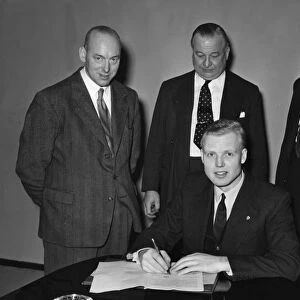 Mike Hawthorn signing Vanwall contract 1955. Creator: Unknown