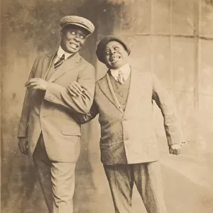 Photograph of two men linking arms, 1910s - 1920s. Creator: The Bell Studio
