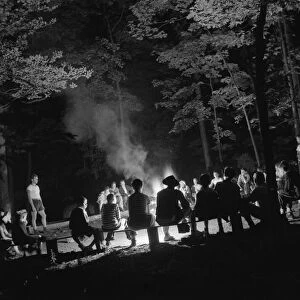 Singing around the camp fire at Camp Nathan Hale, Southfields, New York, 1943 Creator: Gordon Parks