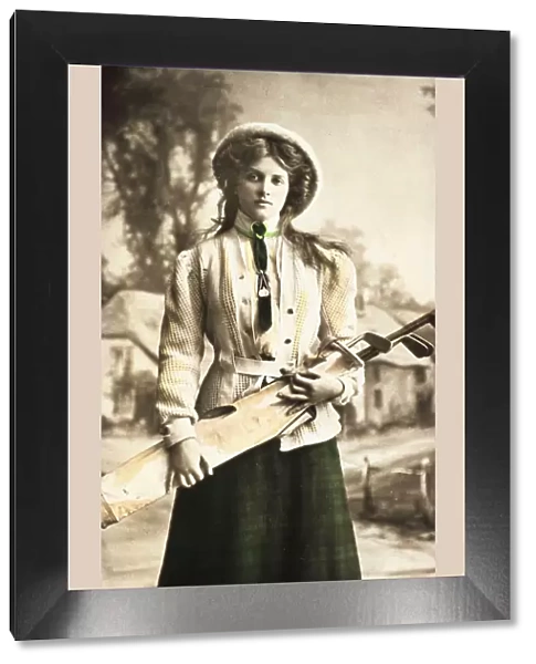 Postcard of a woman golfer, c1912