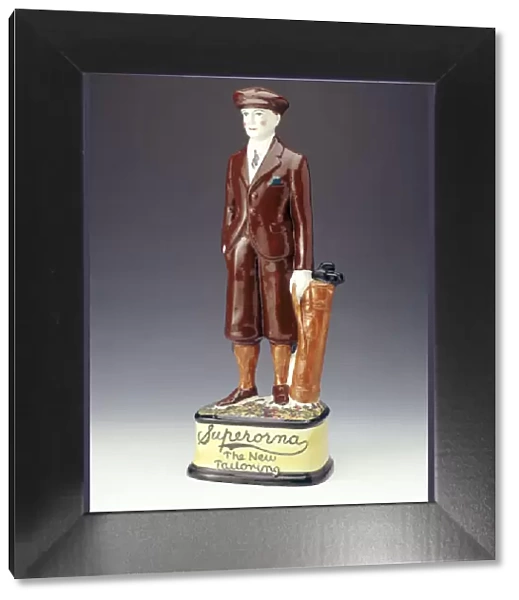 Pottery figure of a golfer advertising Superorna tailoring, 1920s