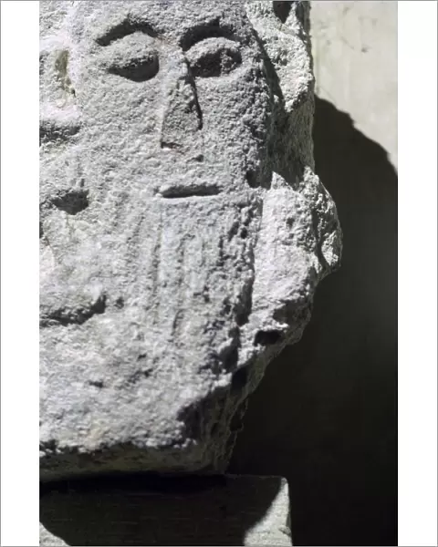 Detail of a stone head in Penmon Priory