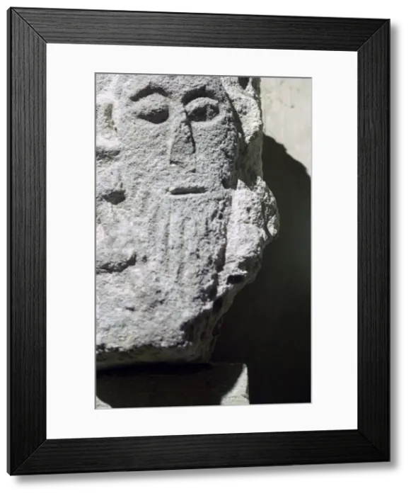 Framed Print : Detail of a stone head in Penmon Priory Framed Print : Detail of a stone head in Penmon Priory