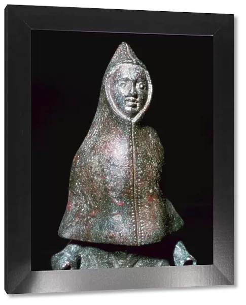 Roman bronze figure of a man wearing a cloak, 4th century