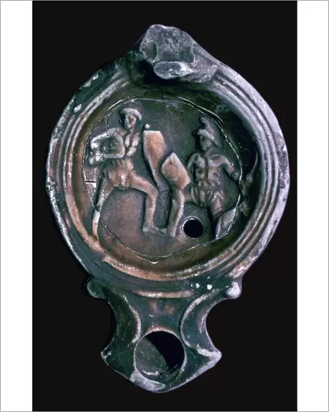 Roman clay lamp with design of gladiators, 3rd century