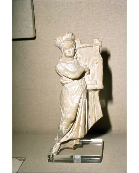 Greek Terracotta, Woman playing Kithera with plectrum, 3rd century BC-2nd century BC