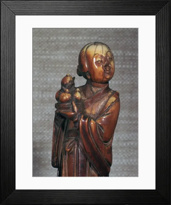 Framed Print : Ivory Chinese figurine of an attendent to Hsi Wang Mu, 17th century Framed Print : Ivory Chinese figurine of an attendent to Hsi Wang Mu, 17th century