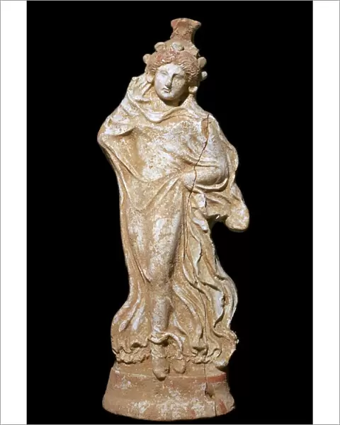 Greek terracotta of a woman in a flowing dress