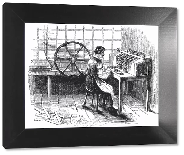 Man operating machine punching cards for Jacquard looms, 1844