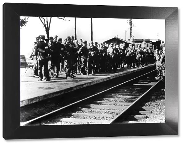 German soldiers on a railway platform awaiting transport, Paris, August 1940