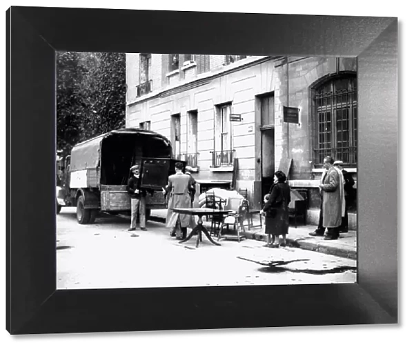 Delivery of furniture confiscated from Jews to victims of RAF bombing, Paris, April 1942